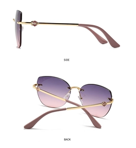 Detail view of cat eye sunglasses showing side and back temples with gold chain design