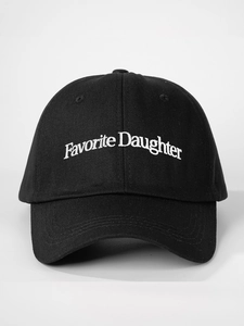 Close-up of white Favorite Daughter embroidery on a black cotton baseball cap