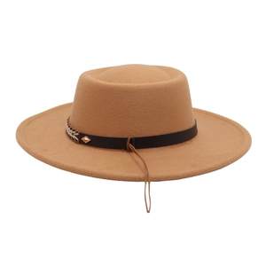 Close-up of camel felt hat with woven leather band and gold diamond rivet detail