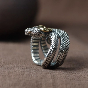 Vintage 925 silver snake ring with golden accents and detailed scales in retro style