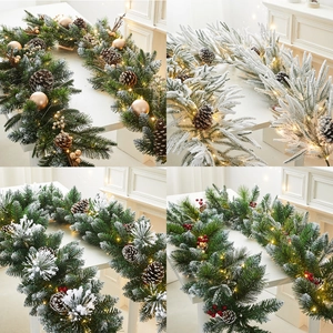 Pre-lit white flocked Christmas garland with pine cones and berries for festive decor