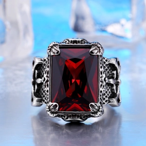Retro steel ring featuring a large rectangular red gemstone set on ice background