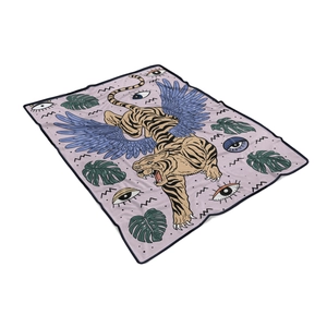 Macro view of flying tiger flannel blanket showing plush texture and edge binding
