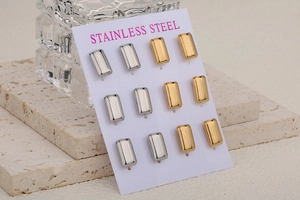 Detail of 12-piece stainless steel rectangular stud earrings in gold and silver finish