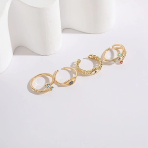 Set of four 14K gold plated evil eye adjustable rings with colorful crystals