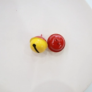 Detailed macro view of 2.2cm yellow and red bicolor painted metal DIY craft bells