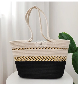 Detail of tricolor woven cotton tote bag showing texture and geometric patterned band