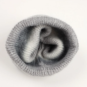 Detailed interior view showing neat stitching and grey ombre gradient knit texture