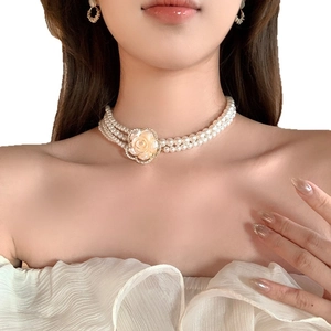 Three-layer resin pearl choker necklace with a yellow flower pendant and gold-set crystals
