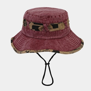 Detail view of burgundy washed denim bucket hat with printed trim and windproof chin strap