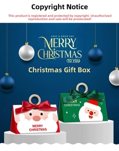 Macro shot of triangular Christmas gift boxes with Santa Claus and ribbon handles