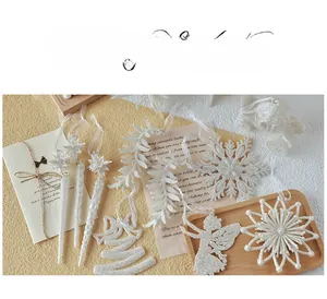 Detailed set of white glitter Christmas ornaments with snowflake, angel and bell shapes