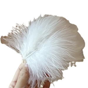 Elegant white velvet hair clip with delicate feathers and pearl accents for women