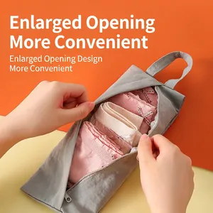 Grey waterproof travel organizer bag with wide opening for underwear storage