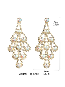 Detailed view of long gold tassel earrings with black rhinestones and size dimensions