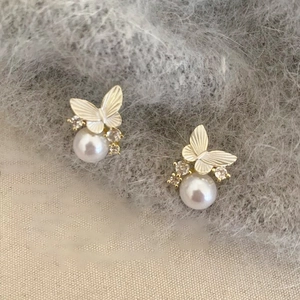Elegant butterfly pearl earrings with gold accents and sparkling crystals for women