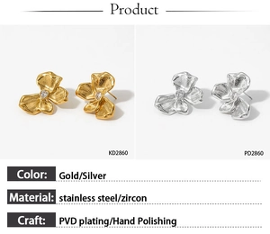 Detail of butterfly zircon earrings in gold and silver with PVD plated brushed finish