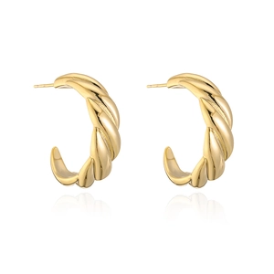 Detailed view of C-shaped earrings with twisted texture in 18k gold plated finish