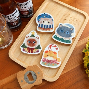 Wooden cat-themed beer bottle opener and coasters set on a rustic wooden tray table