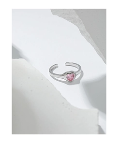 Macro shot of S925 sterling silver band with pink heart-shaped zircon gemstone