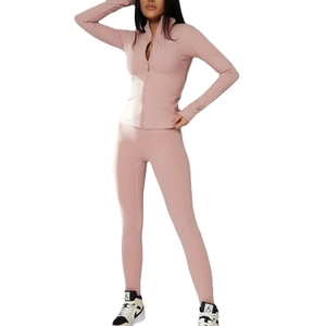 Pink slim-fit women's sports set with zip-up jacket and high-waist yoga leggings
