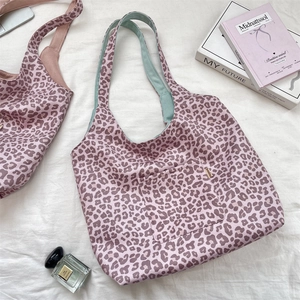 Pink leopard print suede tote bag with mint green lining and contrast shoulder strap