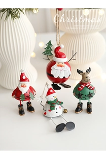 Detailed close-up of colorful painted metal Christmas ornaments with Santa and Snowman