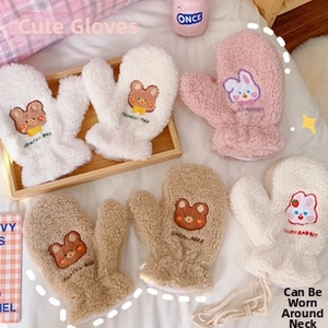 Detail view of plush cartoon mittens with animal embroidery and anti-loss neck cords