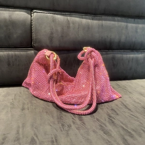 Sparkling pink rhinestone hobo bag with crystals and silver chain rings for women