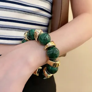 Fashion acrylic round beaded bracelet with green marble texture and gold metal accents
