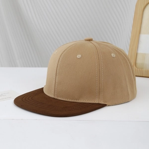 Detail of two-tone hip hop baseball cap in khaki and brown twill cotton fabric