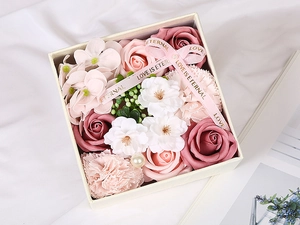 Top view of pink and peach soap flower gift box with roses, carnations and pearl detail