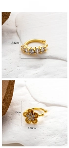 Detailed size view of gold flower and star cubic zirconia cartilage ear clips