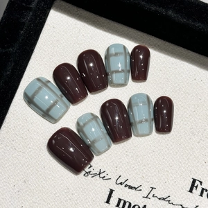 Press-on nail set in hazy blue plaid and coffee brown with glossy short oval finish