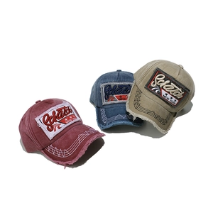 Vintage washed cotton baseball caps with New York embroidery and distressed edge details