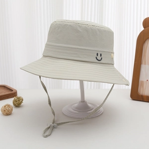 Close-up of quick-dry kids bucket hat with smiley embroidery and adjustable chin strap