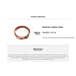 Detail of dark brown leather belt with gold alloy buckle showing 108cm length measurement
