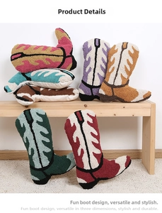 Close-up of tufted geometric boot-shaped cushions featuring textured embroidery details