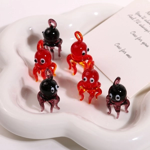 Handcrafted glass octopus pendants in red and purple for DIY jewelry making