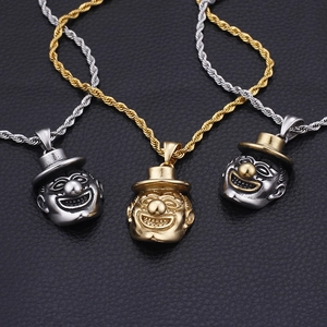 Detailed view of hip hop joker pendants in silver, gold, and dual-tone finishes on chains