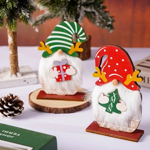 Christmas wooden gnome tabletop decorations with XMAS sign and festive forest elements