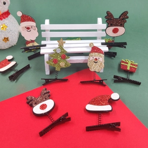 Glitzernde Weihnachts-Haarclips mit Weihnachtsmann- und Rentier-Motiven auf Metall