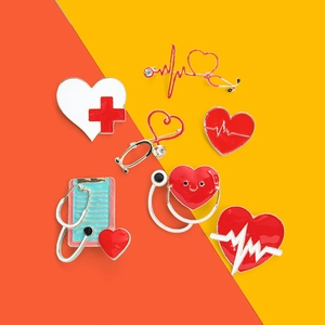 Detailed set of 7 medical enamel pins featuring red cross and stethoscope heart designs