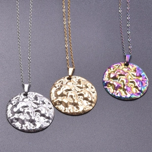 Detailed view of round textured geometric pendants in silver, gold and rainbow finishes