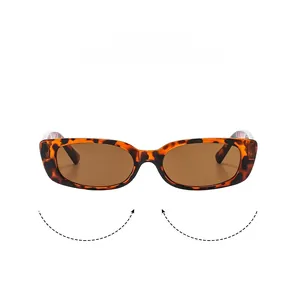 Close-up of tortoise shell frame and brown oval lenses on vintage square sunglasses