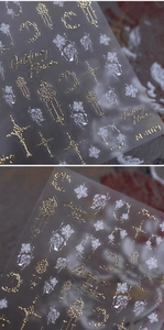 Macro view of M-869 gold leaf floral and cross patterns on embossed nail art stickers