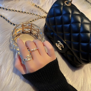 Gold plated sparkling zircon open ring set featuring layered and snake-like design