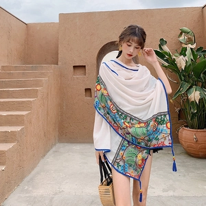 Ethnic style white embroidered linen shawl with blue tassels and floral patterns