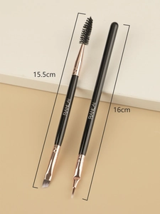 Detailed view of dual-ended eyebrow and eyeliner brushes with rose gold metal ferrules