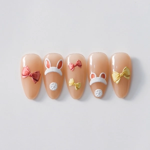 Stickers ongles relief 3D avec nœud mignon et oreilles de lapin sur base nude jelly